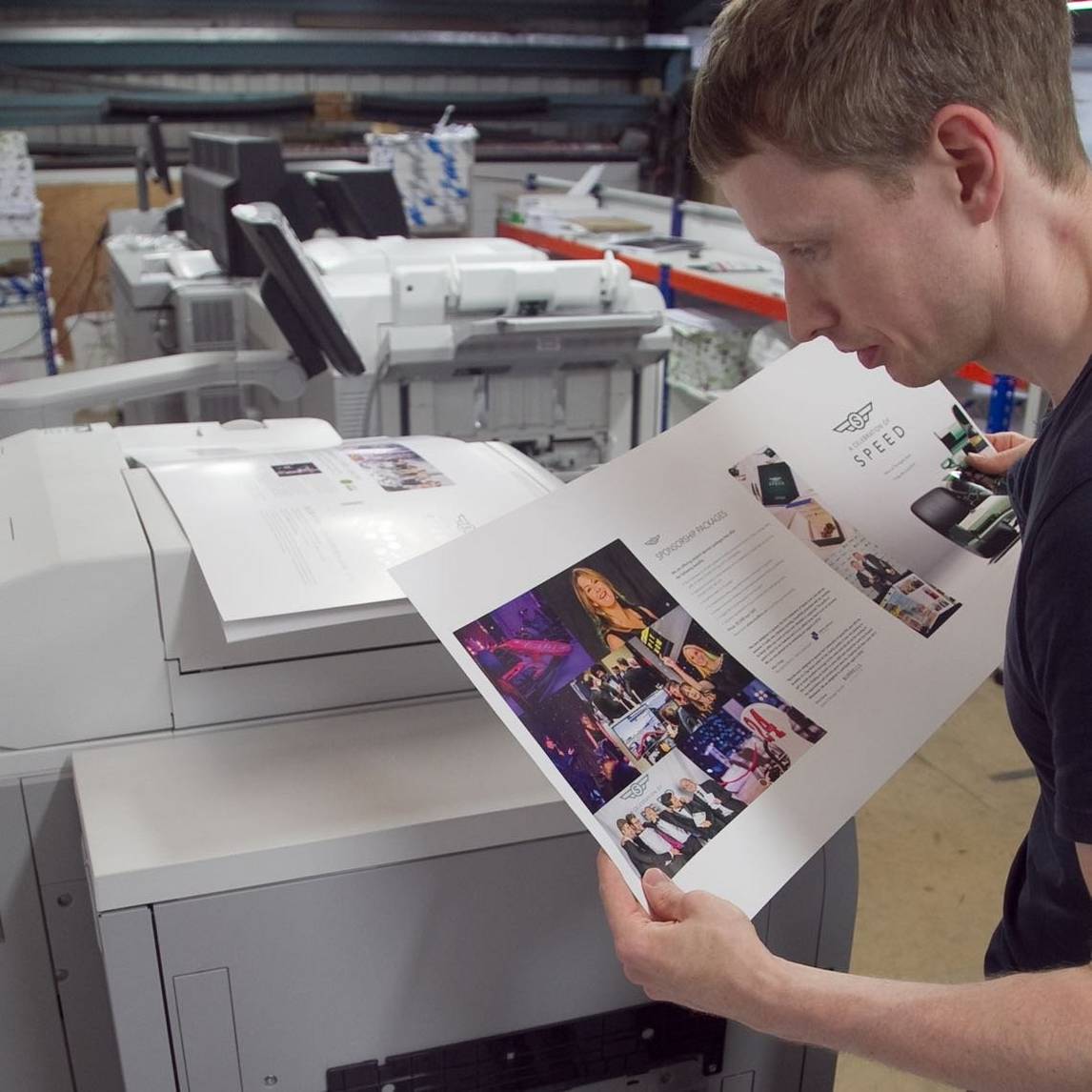 man looking at paper
